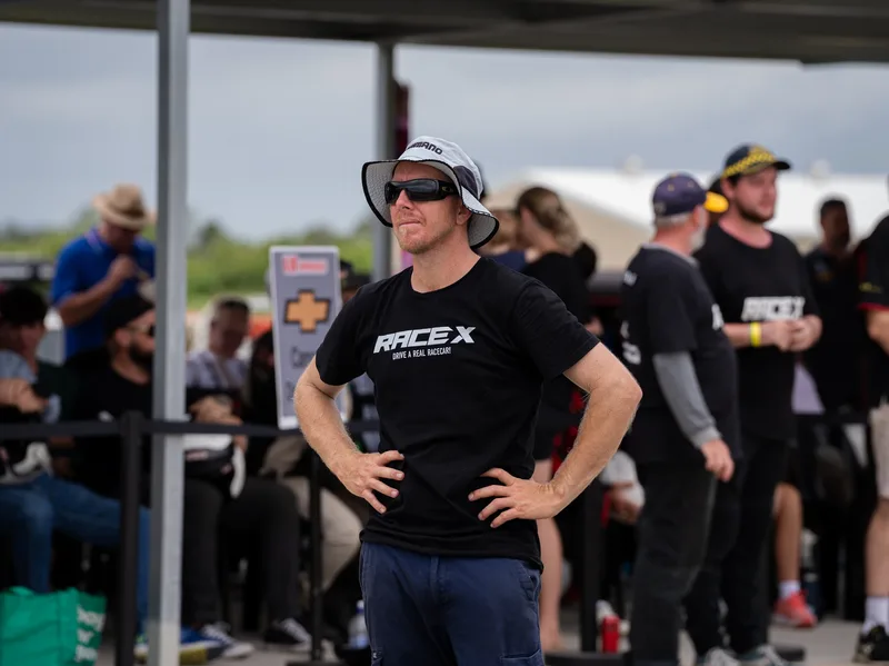 RACEX team member and guests in the pit area
