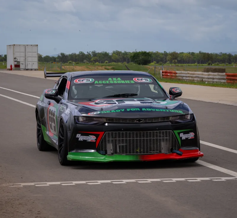 EFS-liveried Camaro approaching the chequered line